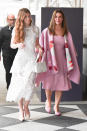 <p>Mother of the bride Melina opted for a statement-making pink ensemble, while Jennifer went bridal (of course!) in her floaty white dress. </p>