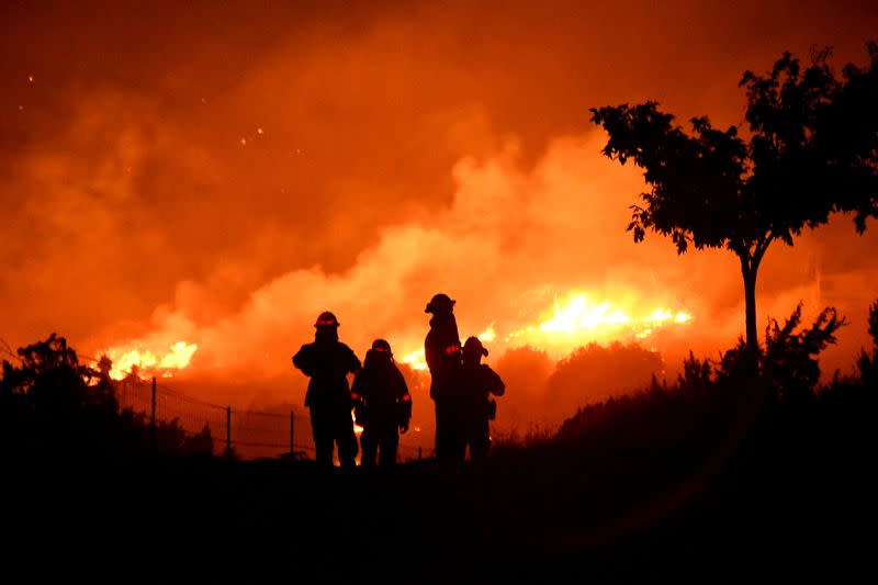 FILE PHOTO: FILE PHOTO: Wildfire in California burns through the night north of Los Angeles