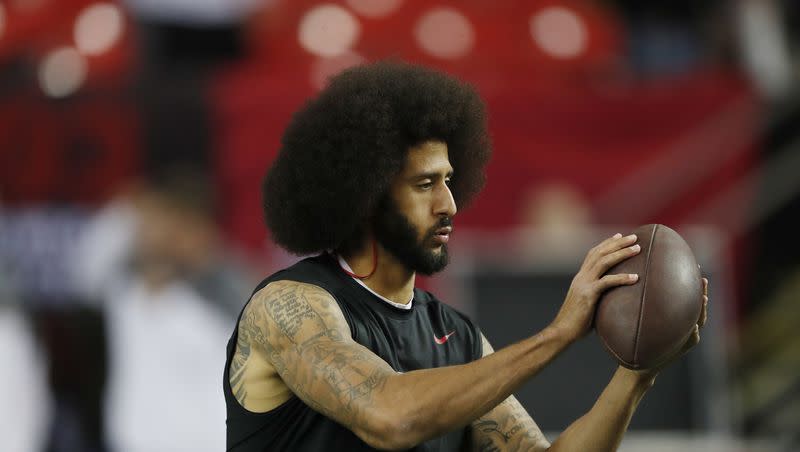 Colin Kaepernick warms up before a game between the Atlanta Falcons and the San Francisco 49ers on Dec. 18, 2016, in Atlanta.