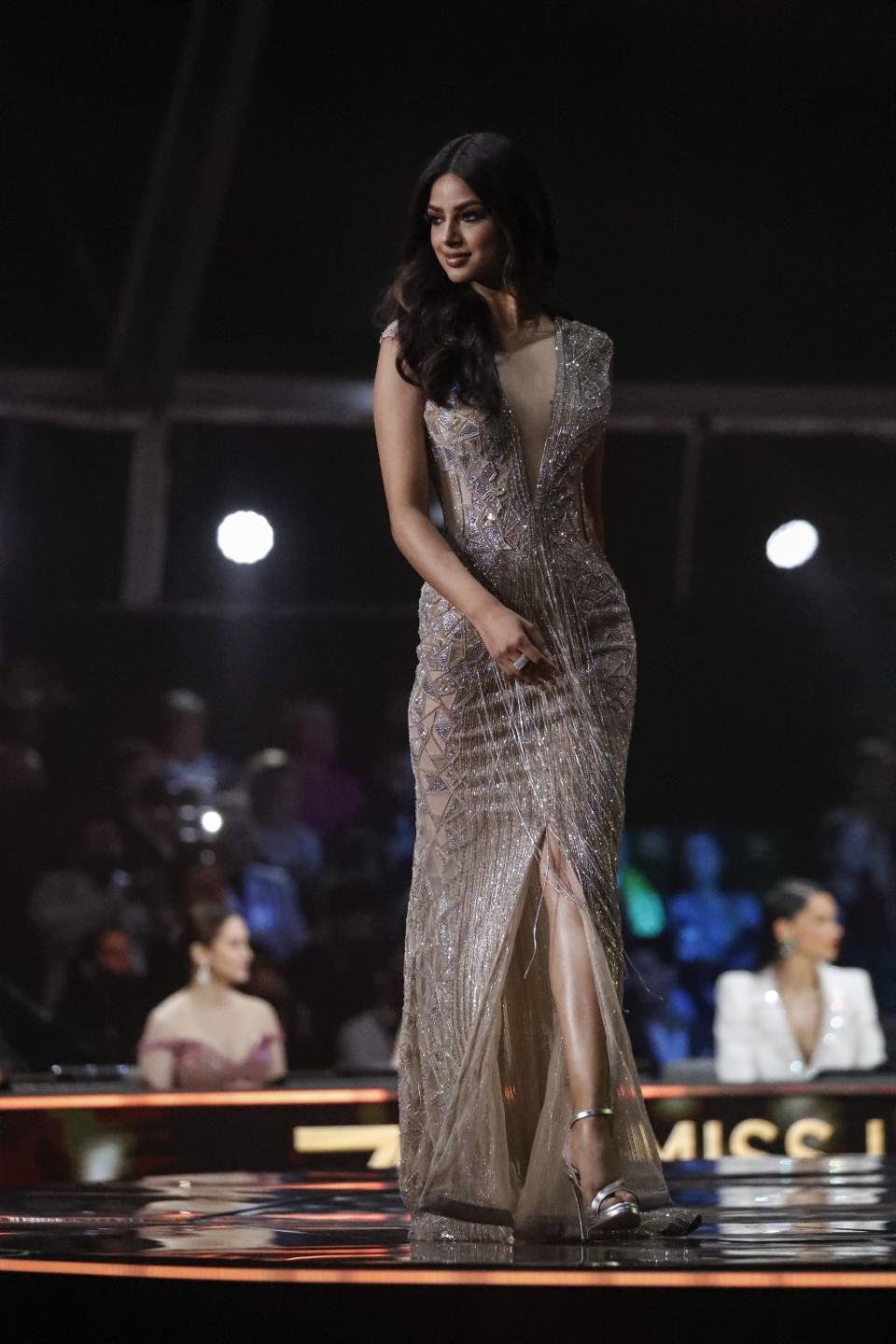 India’s Harnaaz Sandhu participates in the evening gown stage of the 70th Miss Universe pageant, Monday, Dec. 13, 2021, in Eilat, Israel. - Credit: AP Photo/Ariel Schalit