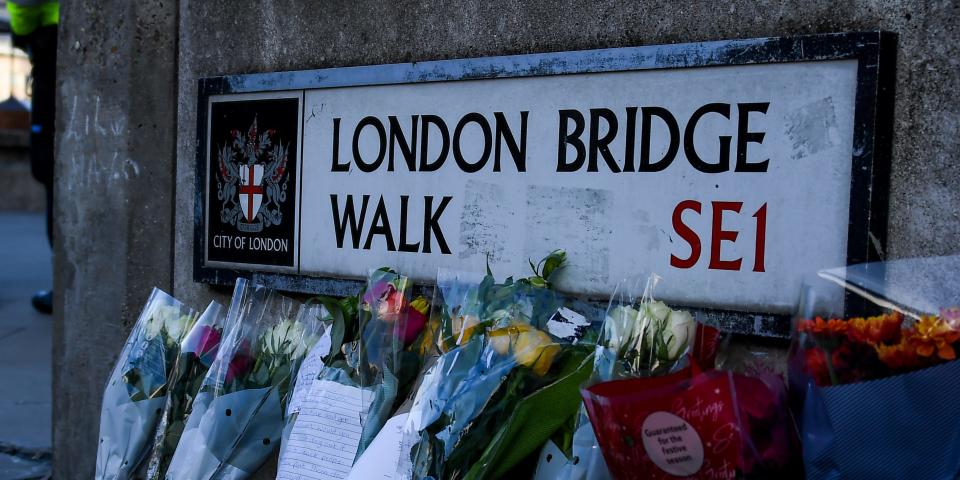 Flowers are left following Friday's terror attack on London Bridge in London, Sunday, Dec. 1, 2019.  A man wearing a fake suicide vest was subdued by bystanders as he went on a knife rampage killing two people and wounding others before being shot dead by police on Friday. (AP Photo/Alberto Pezzali)