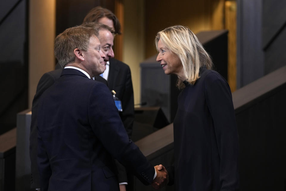 Netherland's Defense Minister Kajsa Ollongren, right, speaks with British Defense Secretary Grant Shapps, left, during a meeting of the North Atlantic Council in NATO defense ministers format at NATO headquarters in Brussels, Friday, June 14, 2024. (AP Photo/Virginia Mayo)