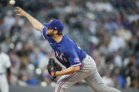 Texas Rangers starting pitcher Jordan Lyles works against the Colorado Rockies in the fifth inning of a baseball game Wednesday, June 2, 2021, in Denver. (AP Photo/David Zalubowski)