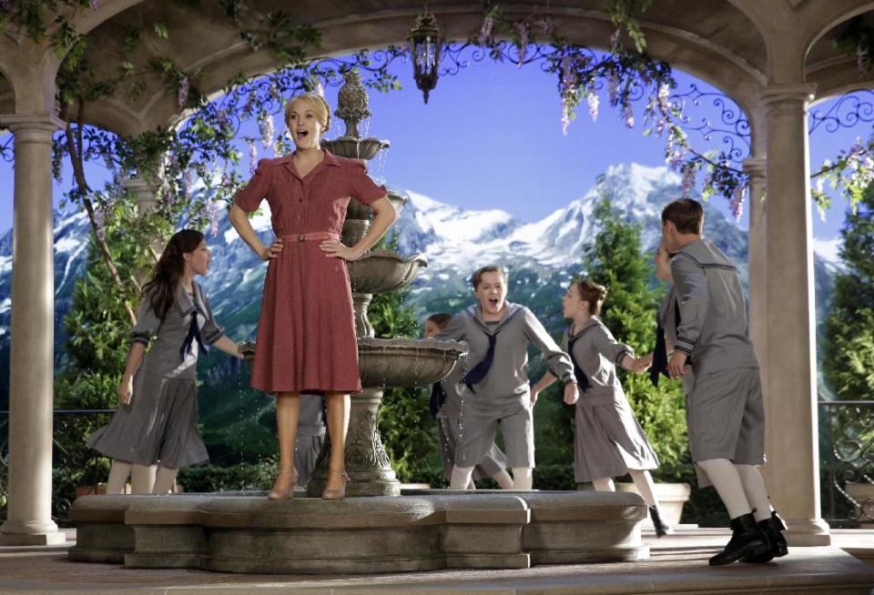 This image released by NBC shows Carrie Underwood, foreground, as Maria, during preparations for "The Sound of Music Live!, in Bethpage, N.Y. The live production airs on Dec. 5 at 8 p.m. EST. (AP Photo/NBC, Paul Drinkwater)