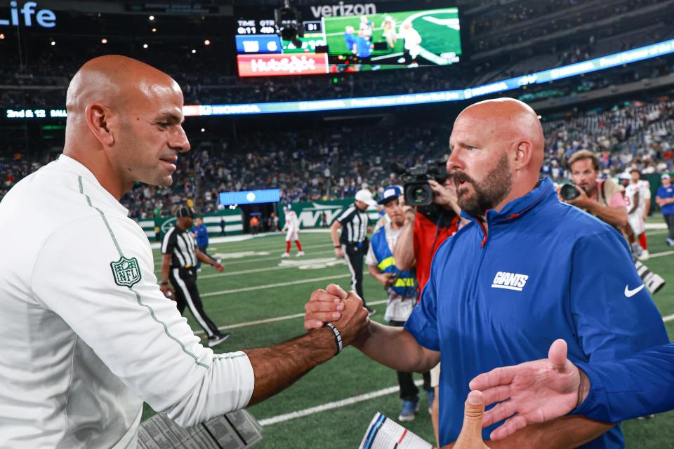 Aug 24, 2024; East Rutherford, New Jersey, USA; New York Jets head coach Robert Saleh, left, shakes hands with New York Giants head coach Brian Daboll after the game at MetLife Stadium. Mandatory Credit: Vincent Carchietta-USA TODAY Sports