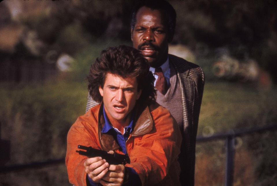 Mel Gibson (left) and Danny Glover are reluctant partners in the Christmas-themed action film &quot;Lethal Weapon.&quot;