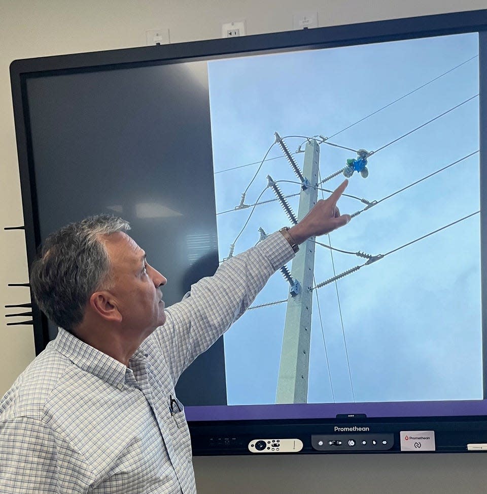 Lake Worth Beach Electric Utility Executive Director Ed Liberty points to Mylar balloon that caused power outage. Mylar is a thin, plastic, polyester film that is different and stronger than traditional latex balloons.