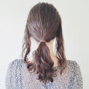 <p>Take two sections from the front sides of your hair and tie the rest back in a ponytail. </p>