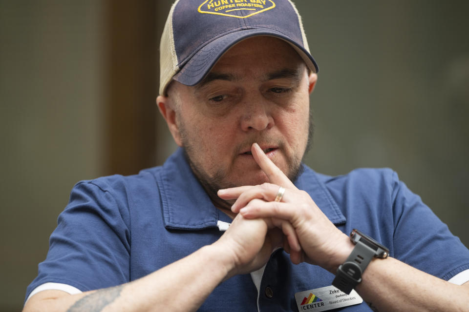 Zeke Cork, a board of directors member at The Center, describes what he witnessed during protests and ensuing arrests over the silencing of transgender lawmaker Zooey Zephyr at the Montana State Capitol, during an interview with The Associated Press at The Center in Missoula, Mont., Tuesday, April 25, 2023. (AP Photo/Tommy Martino)