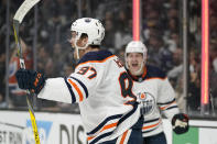 Edmonton Oilers center Connor McDavid, left, celebrates a power play goal by left wing Zach Hyman during the first period in Game 3 of an NHL hockey Stanley Cup first-round playoff series against the Los Angeles Kings Friday, May 6, 2022, in Los Angeles. (AP Photo/Mark J. Terrill)