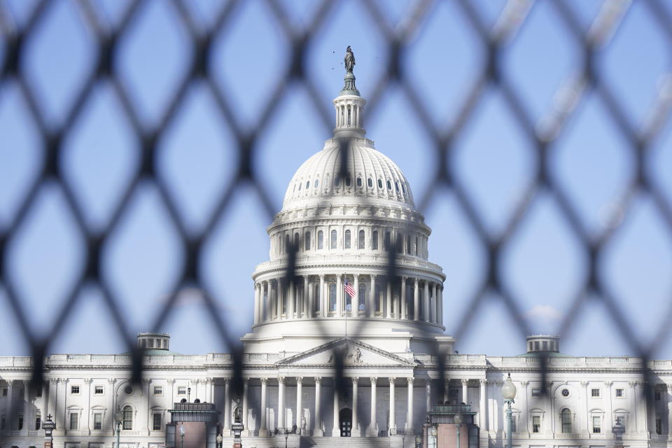 The Capitol is seen through security fencing, Thursday, March 4, 2021, on Capitol Hill in Washington. Capitol Police say they have uncovered intelligence of a "possible plot" by a militia group to breach the U.S. Capitol on Thursday, nearly two months after a mob of supporters of then-President Donald Trump stormed the iconic building to try to stop Congress from certifying now-President Joe Biden's victory. (AP Photo/Jacquelyn Martin)
