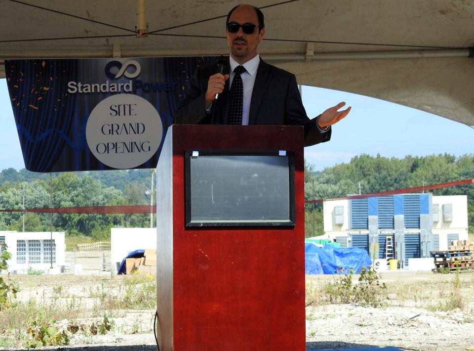 Standard Power CEO Max Serezhin speaks at a ribbon cutting for his company's new blockchain and data mining center in Coshocton. They are focused on bitcoin now, but Serezhin hopes to expand to other types of data operations and increase power for their operations in 2023. He said they should also have more than 100 employees by the end of next year.