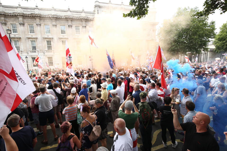 <p>Free Tommy Robinson supporters and pro-Trump supporters come together on Whitehall, London, for a joint rally in support of the visit of the U.S. president to the U.K. and calling for the release of jailed far-right activist Tommy Robinson. (Photo: Yui Mok/PA Images via Getty Images) </p>