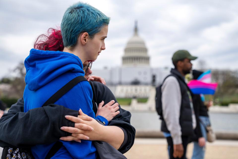 A couple embraces during a rally as part of Transgender Day of Visibility in March by the Capitol in Washington. Transgender people and their allies gathered at venues across the country as part of an annual, international recognition of transgender resilience, which this year comes amid what some denounced as an increasingly hostile climate.