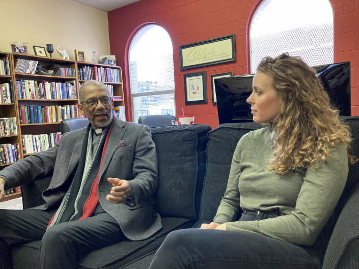 The Rev. Darryl Gray, left, and the Rev. Lauren Bennett speak in Bennett's office in St. Louis, Mo., on Jan. 10, 2023. Both served as spiritual advisers at recent executions in Missouri, sitting alongside the inmates and touching them as the process occurred. Spiritual advisers have been increasingly present during executions since a Supreme Court ruling last year. (AP Photo/Jim Salter