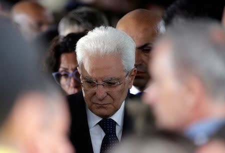 Italian President Sergio Mattarella leaves at the end of a funeral service for victims of the earthquake that levelled the town in Amatrice, central Italy, August 30, 2016. REUTERS/Max Rossi