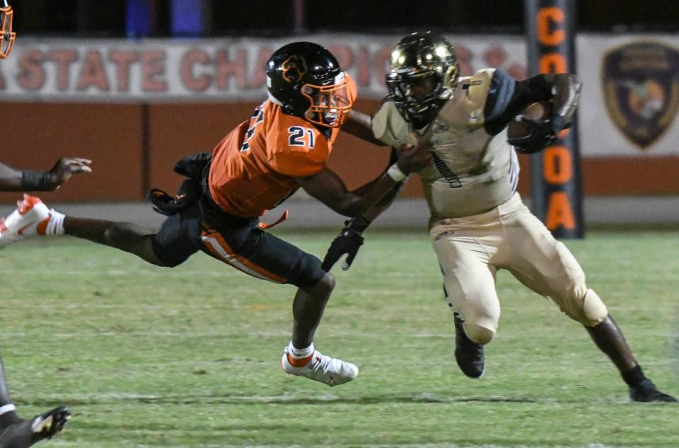 Cocoa safety Cedrick Hawkins tackles Treasure Coast running back Eden James on Friday, Sept. 24, 2021.