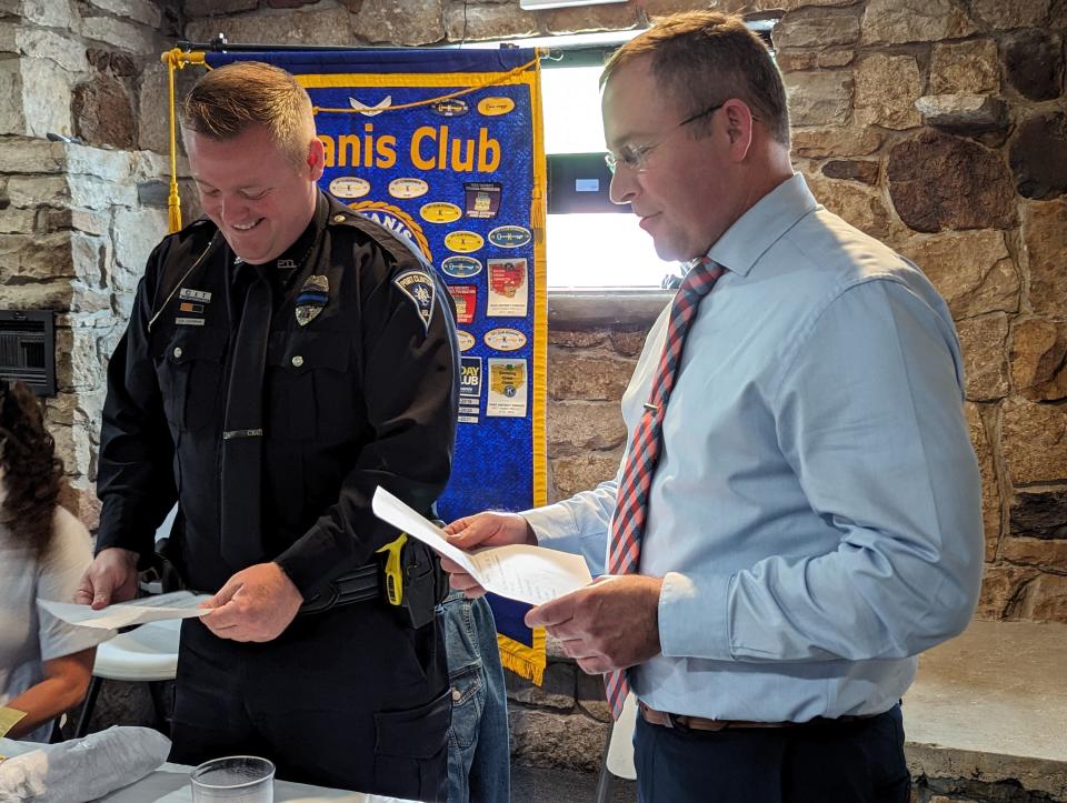 Officer Curt Cochran, left, and Port Clinton Police Chief David Scott stand at the Port Clinton Kiwanis Law Enforcement Awards ceremony on Wednesday.