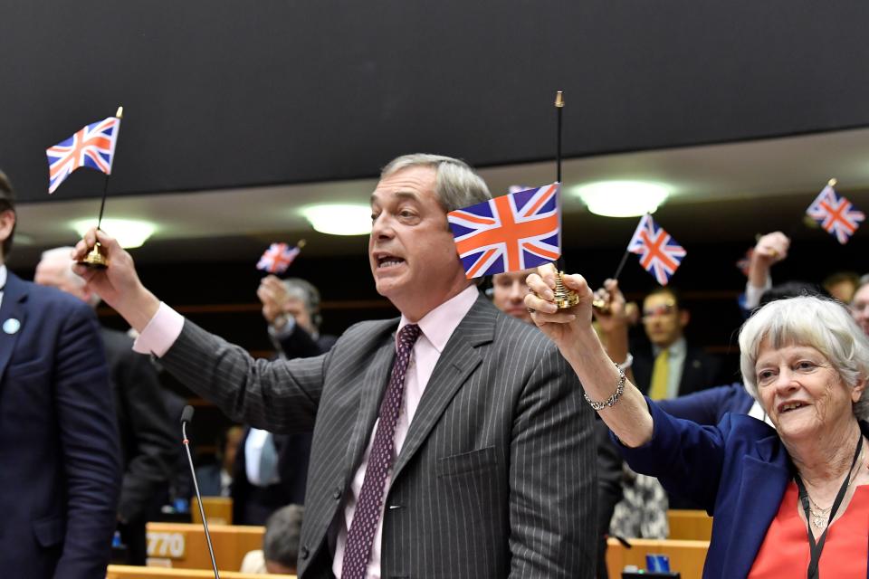 Britain's Brexit Party leader Nigel Farage holds a union flag during a European Parliament plenary session in Brussels on January 29, 2020, as Brexit Day is to be set in stone when the European Parliament casts a vote ratifying the terms of Britain's divorce deal from the EU. (Photo by JOHN THYS / AFP) (Photo by JOHN THYS/AFP via Getty Images)