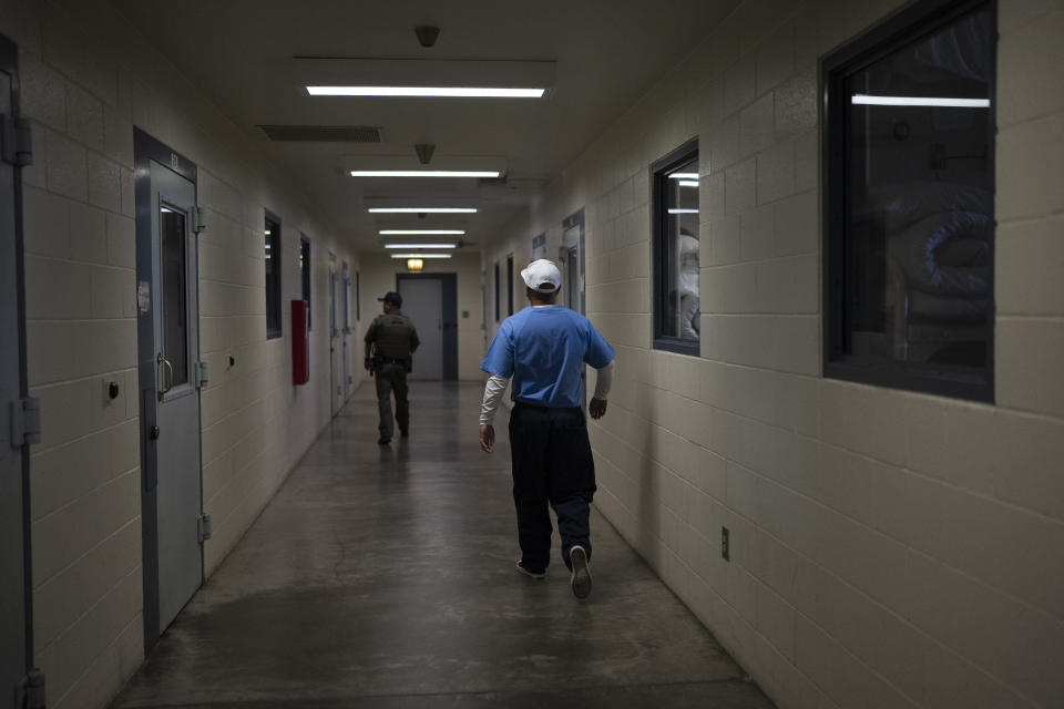 Joseph Sena, 27, walks to his cell at Valley State Prison in Chowchilla, Calif., Friday, Nov. 4, 2022. Sena spent years trying to make himself a better person after spending nearly half of his 27 years in prison for killing a man. He took courses in poetry and mental health and other topics at a central California prison, hoping to be seen as fit for parole and ready to live outside prison if the day he was free ever came. (AP Photo/Jae C. Hong)