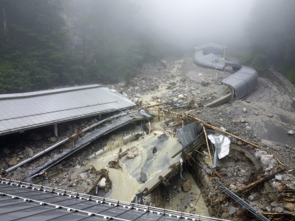 The bobsleigh and luge track is completely destroyed by debris due to the severe storm in the night of July 18, in Konigssee, Germany, Monday, July 19, 2021. (Peter Kneffel/dpa via AP)