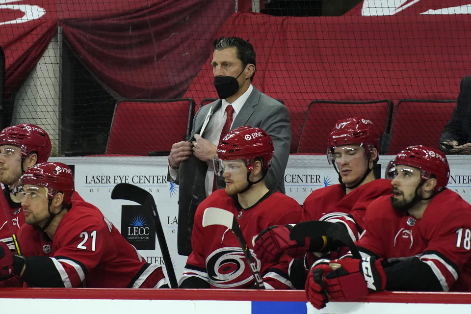 Carolina Hurricanes coach Rod Brind'Amour watches during the second period of the team's NHL hockey game against the Dallas Stars in Raleigh, N.C., Sunday, April 4, 2021. (AP Photo/Gerry Broome)