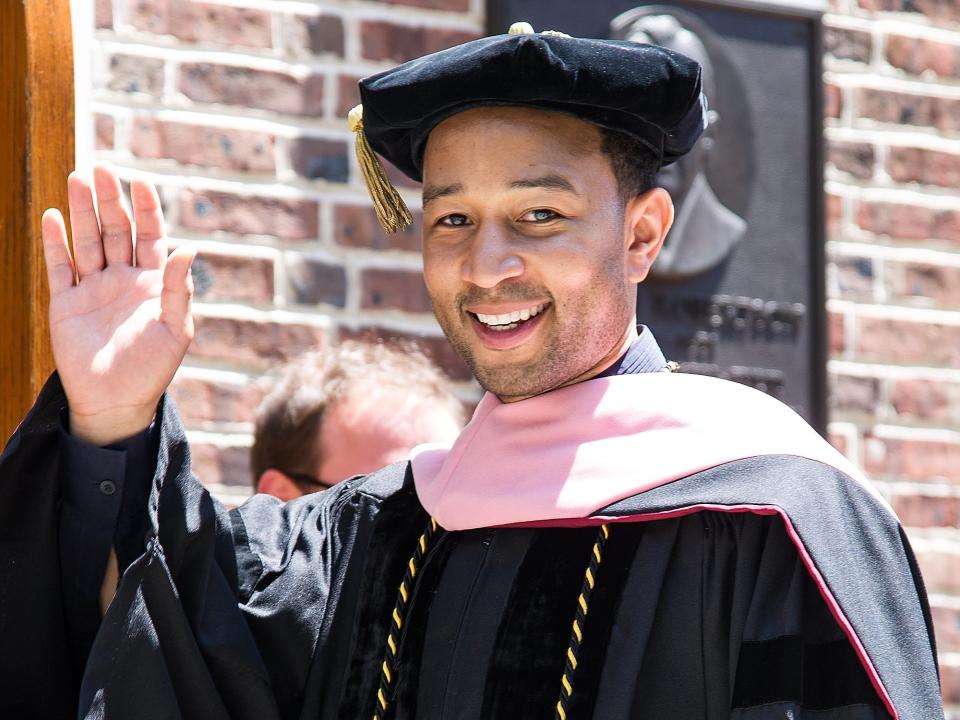 John Legend in a graduation cap and gown upon receiving his honorary doctorate from the University of Pennsylvania