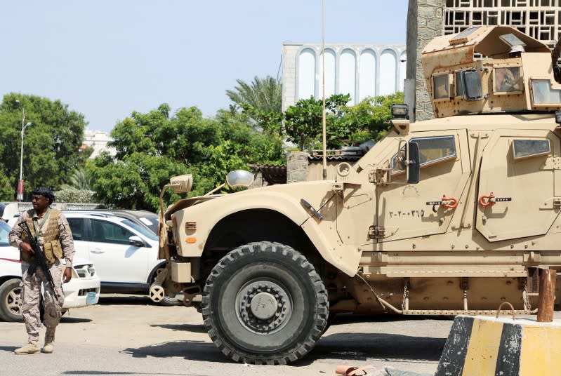 FILE PHOTO: Saudi soldier walks past an armored personnel carrier outside a hospital during the delivery of Saudi medical aid in Aden