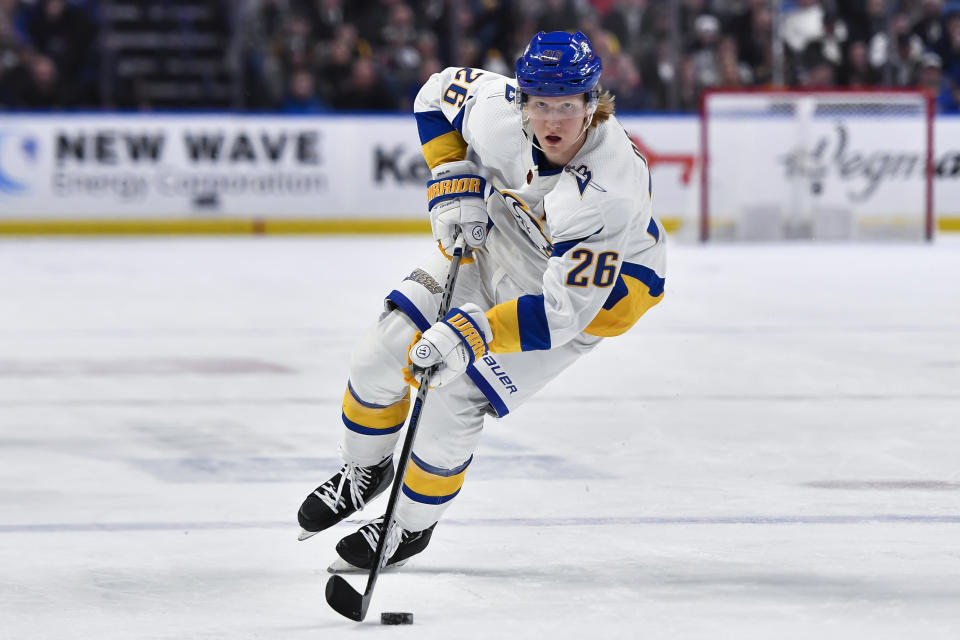 FILE - Buffalo Sabres defenseman Rasmus Dahlin skates with the puck during the second period of the team's NHL hockey game against the Carolina Hurricanes in Buffalo, N.Y., Feb. 1, 2023. Dahlin made clear his objective for the season by saying: “It’s go time. I mean, we don’t have excuses anymore.”(AP Photo/Adrian Kraus, File)