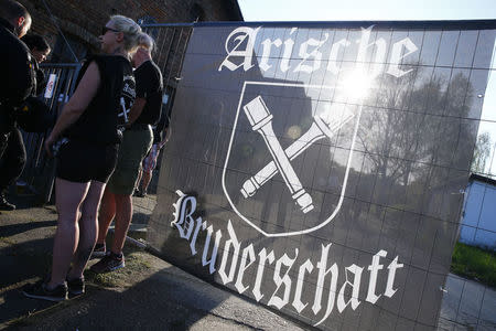 Far-right supporters attend rock music festival "Schwert und Schild" (Sword and Shield) in Ostritz, Germany April 20, 2018. Sign reads "Aryan brotherhood". REUTERS/Hannibal Hanschke