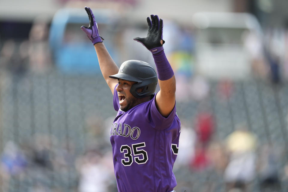 Colorado Rockies' Elias Diaz celebrates after singled to drive in two runs off Chicago White Sox relief pitcher Kendall Graveman, ending the baseball game Wednesday, July 27, 2022, in Denver. (AP Photo/David Zalubowski)