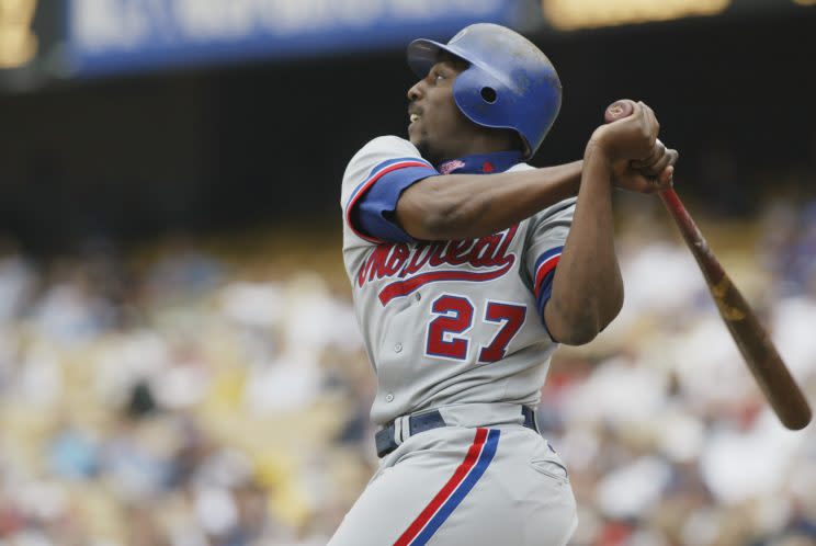 Baseball Hall of Famer Vladimir Guerrero, left, talks with