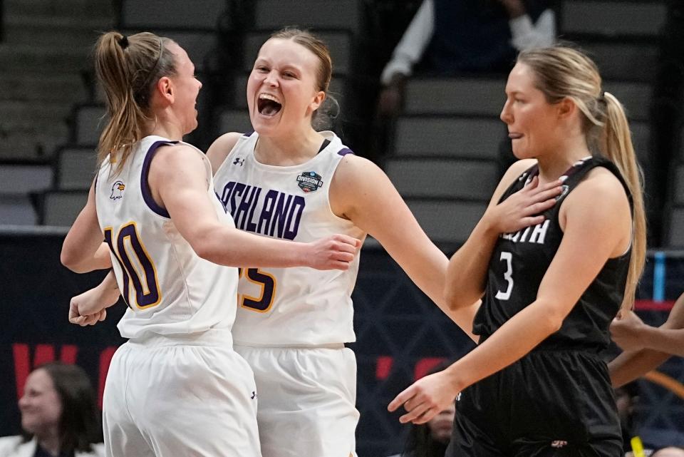 Ashland's Hallie Heidemann and Zoe Miller celebrate a foul in front of Minnesota Duluth's Taya Hakamaki during the first half of an NCAA Women's Division 2 championship basketball game Saturday, April 1, 2023, in Dallas. (AP Photo/Darron Cummings)