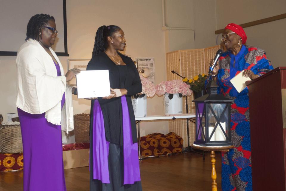 Rachael Drayton, left, president of the Greater Gainesville Black Nurses Association, holds a certificate with Shirly Collins, center, while Vivian Filer, right, co-founder and first president of the group congratulates presents Collins with a $500 scholarship.
(Credit: Photo by Voleer Thomas/For The Guardian)