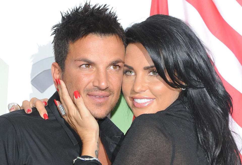 FILE - British model Katie Price and  her musician husband Peter Andre, pose together in this April 14, 2009 file photo. According to news reports in London, Monday May 11, 2009, the couple are to separate after four and a half years of marriage.(AP Photo Ian West, pa, file)  **UNITED KINGDOM OUT: NO SALES: NO ARCHIVE:**