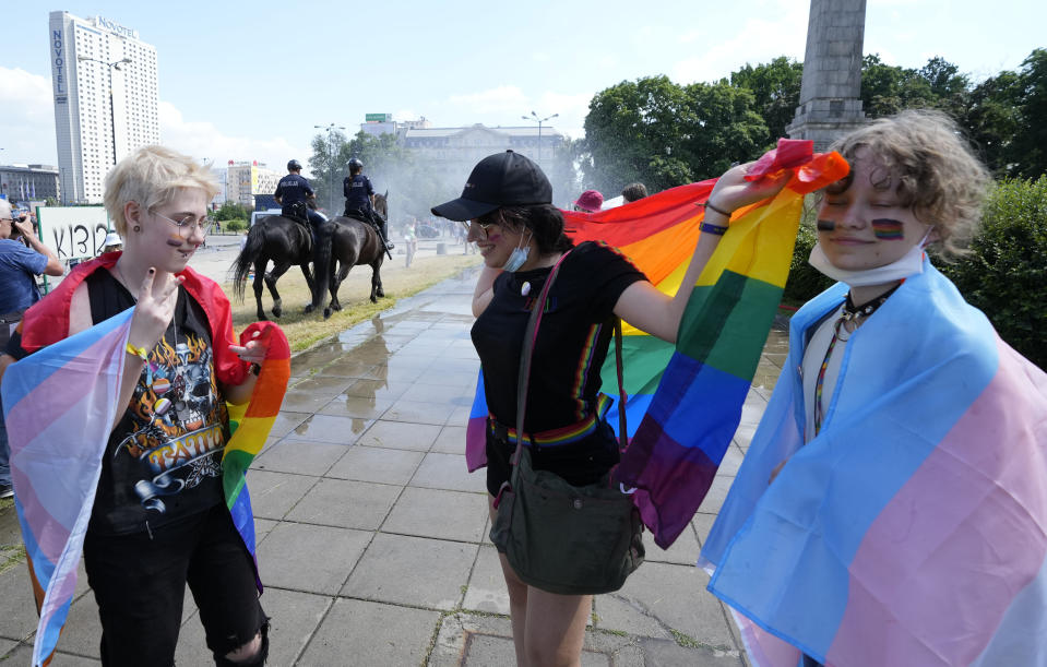 People walk towards the starting point of the Equality Parade, an LGBT pride parade, in Warsaw, Poland, Saturday, June 19, 2021.(AP Photo/Czarek Sokolowski)