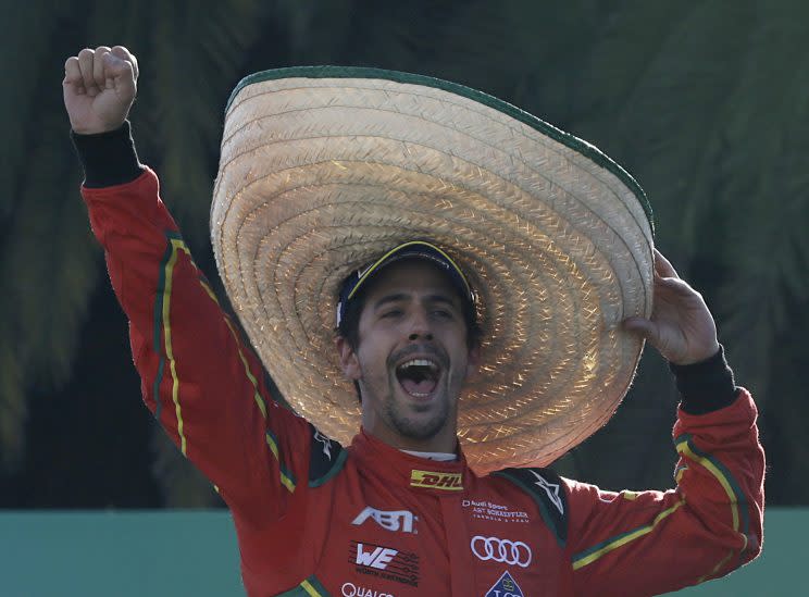 ABT Schaeffler Audi Sport team driver Lucas Di Grassi wearing a Mexican Charro hat celebrates his victory in the Formula E Mexico City ePrix auto race, in Mexico City, Saturday, April 1, 2017. Di Grassi won the race, Techeetah team driver Jean Eric Vergne was second and DS Virgin Racing driver Sam Bird was third. (AP Photo/Marco Ugarte)