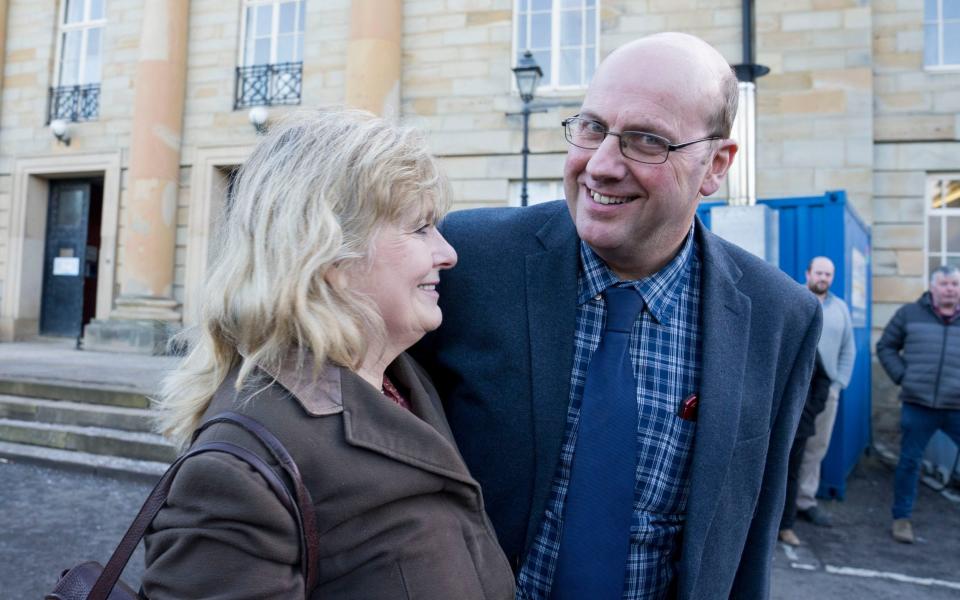 Robert Hooper with Karen Henderson, his partner, outside court - Richard Rayner