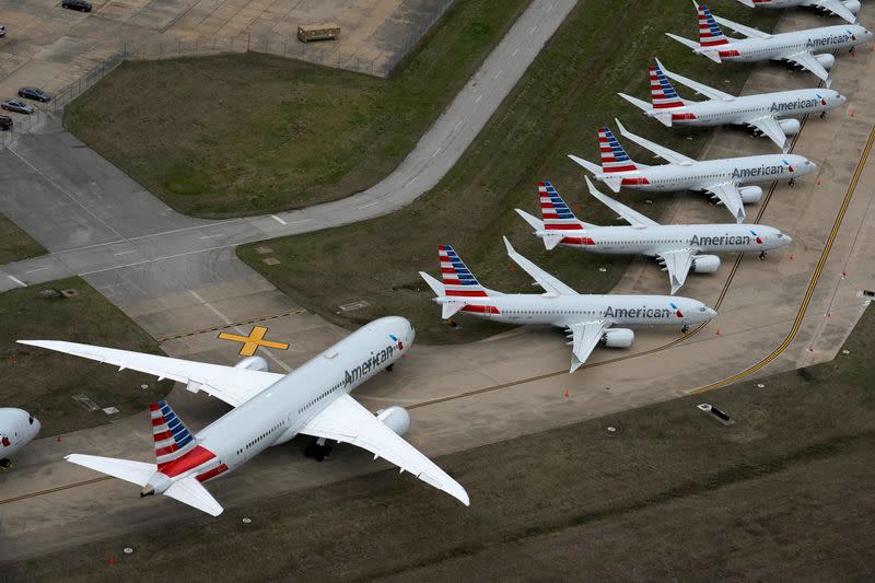 FILE PHOTO: American Airlines passenger planes crowd a runway where they are parked due to flight reductions to slow the spread of coronavirus disease (COVID-19), at Tulsa International Airport in Tulsa