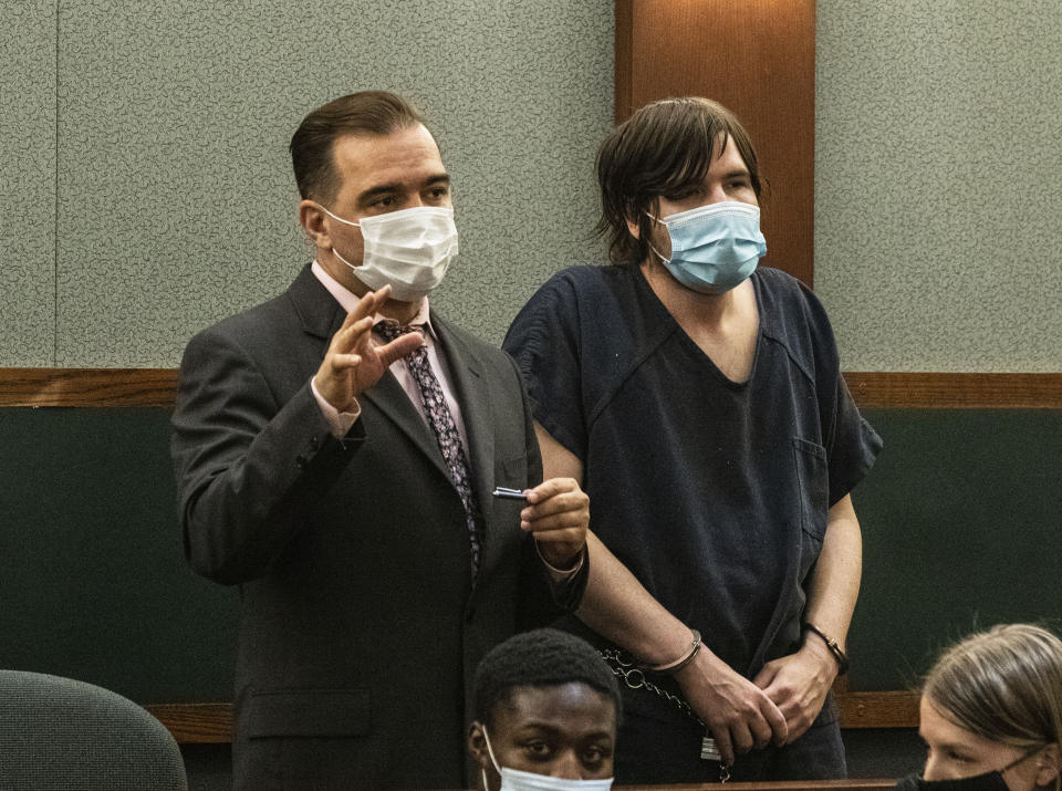 Defense attorney Dustin Marcello, left, addresses the court during Brent Wilson's status check at the Regional Justice Center, on Wednesday, Feb. 17, 2021, in Las Vegas. Marcello, said he expects an indictment to be filed within days in U.S. District Court in Las Vegas. Wilson has been jailed since his arrest Jan. 22 on felony drug possession and gun charges. (Bizuayehu Tesfaye/Las Vegas Review-Journal via AP)