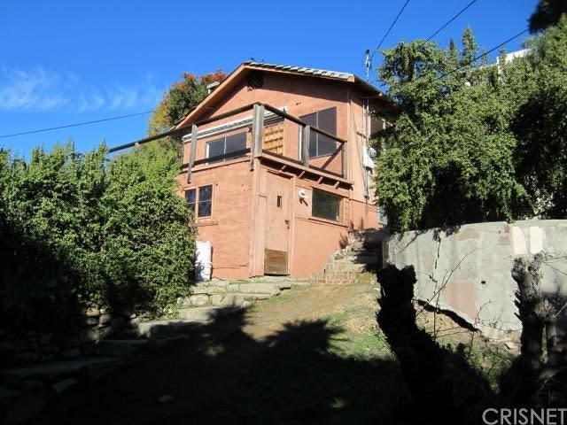 BEFORE: “The thing that really got me were the trees,” she says. “There’s an established California pepper tree and these behemoth yuccas that would otherwise take years and years to grow. I knew that a sea ranch-type house, with simple shapes and beautiful woodwork, would do well with what was here.”