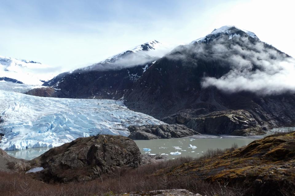 FILE - Chunks of ice float in Mendenhall Lake in front of the Mendenhall Glacier on April 29, 2023, in Juneau, Alaska.