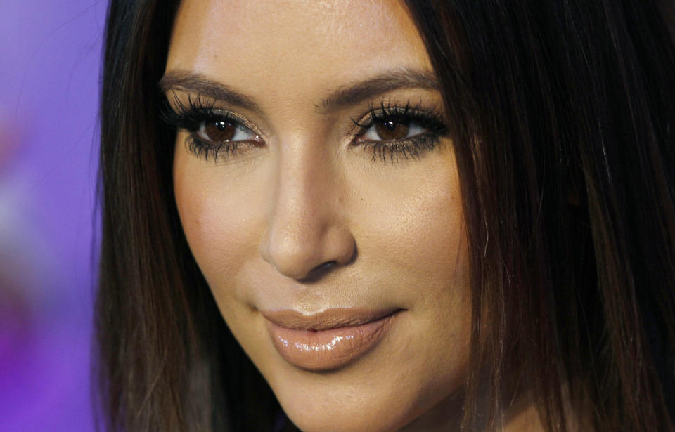 FILE - In this Oct. 4, 2012 file photo, television personality Kim Kardashian poses for photographers at the red carpet during the 40th anniversary of Cosmopolitan magazine in Spanish in Mexico City. Kardashian reportedly gave birth to a baby girl Saturday, June 15, 2013 in Los Angeles. (AP Photo/Marco Ugarte, File)