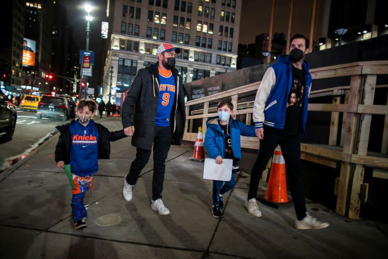 Fans arrive at Madison Square Garden to attend a Knicks game amid the coronavirus disease (COVID-19) pandemic in the Manhattan borough of New York City, New York