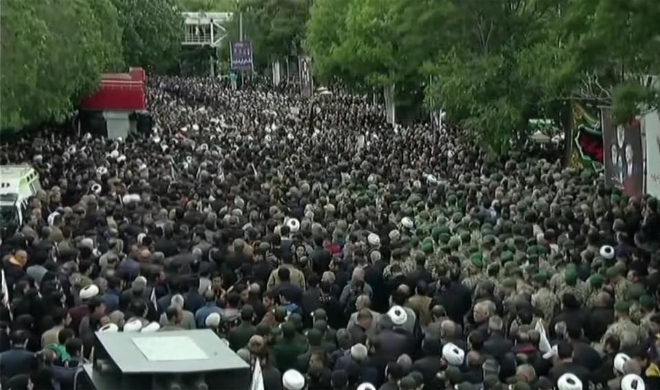 Thousands of Iranians gathered to mourn president Ebrahim Raisi and his entourage, whose helicopter crashed over fog-shrouded mountain in the country’s northwest, in processions setting off from Tabriz (IRAN PRESS/AFP via Getty Images)