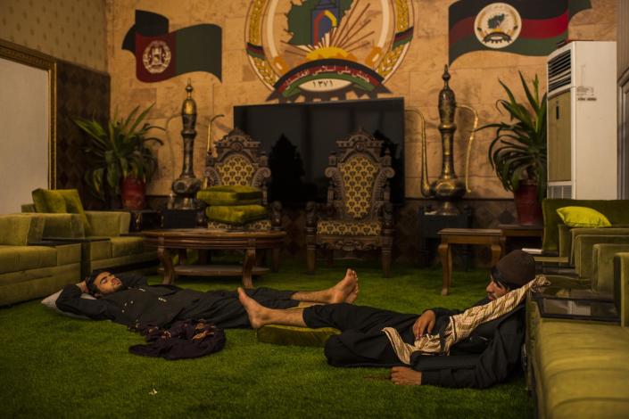 Fighters nap in the luxury of the mansion of former Afghan Vice President Abdul Rashid Dostum. Dostum, also a former warlord, fled the country as provinces in the north, where his influence is strongest, fell to the Taliban. - Credit: Andrew Quilty for Rolling Stone