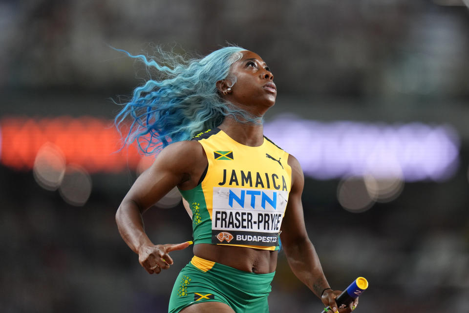 FILE - Shelly-Ann Fraser-Pryce, of Jamaica anchors her team to win a Women's 4x100-meters relay heat during the World Athletics Championships in Budapest, Hungary, Friday, Aug. 25, 2023. (AP Photo/Petr David Josek, File)