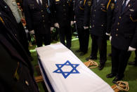 <p>Members of an Israeli Knesset guard stand beside the flag-draped coffin of former Israeli President Shimon Peres during the burial ceremony at the funeral at Mount Herzl Cemetery in Jerusalem on Sept. 30, 2016. (REUTERS/Ronen Zvulun) </p>