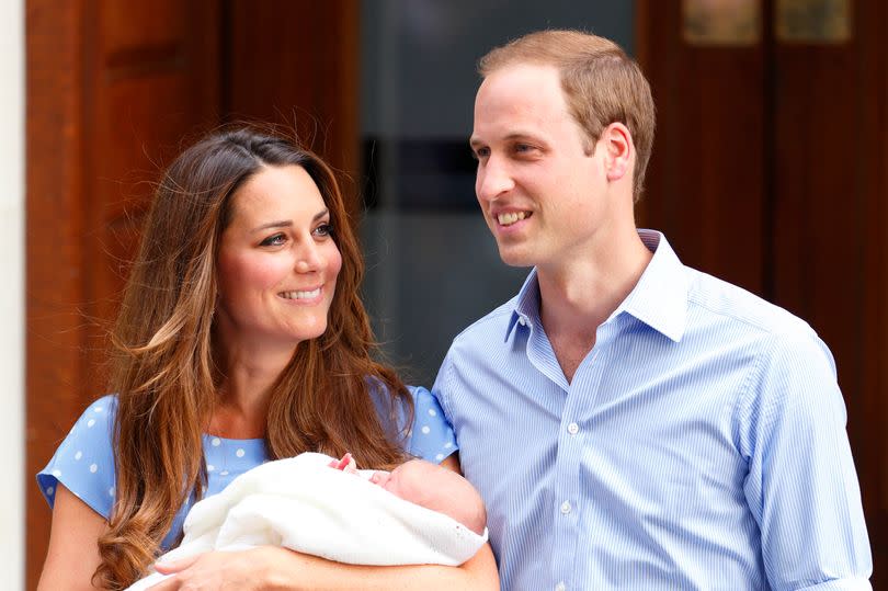 Kate Middleton and Prince William posing for photos outside the Lindo Wing with their newborn son, Prince George