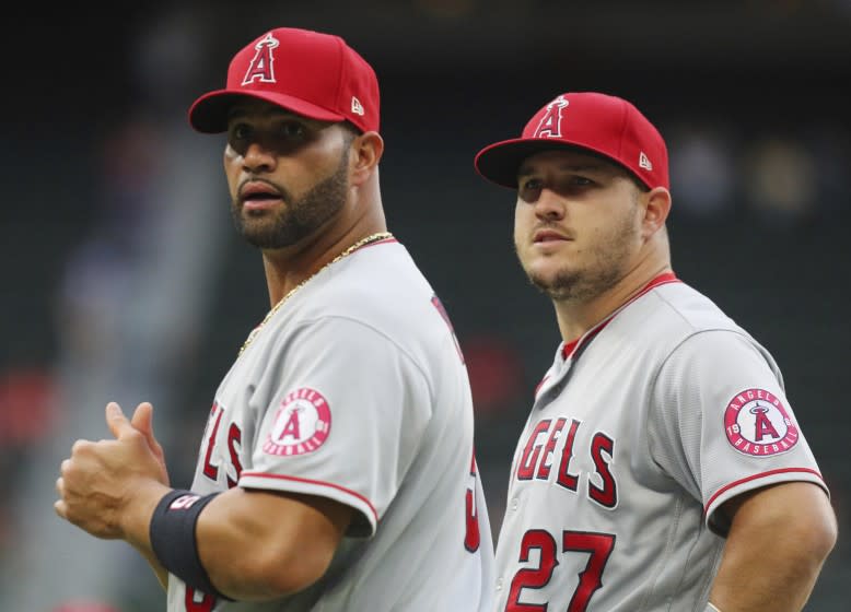 Los Angeles Angels first baseman Albert Pujols (5) and center fielder Mike Trout (27).